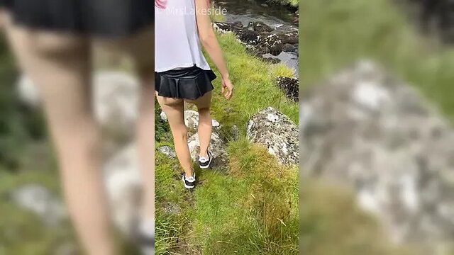 Saucy teen in pink hair shows off naked legs and massive ass in a puffer jacket