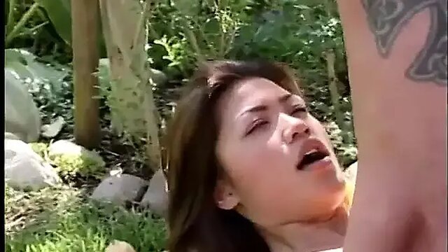 Slender Asian babe gets fucked in doggy style, natural tits bounce