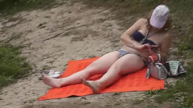 Random guy watches hot topless MILF sunbathe by the river