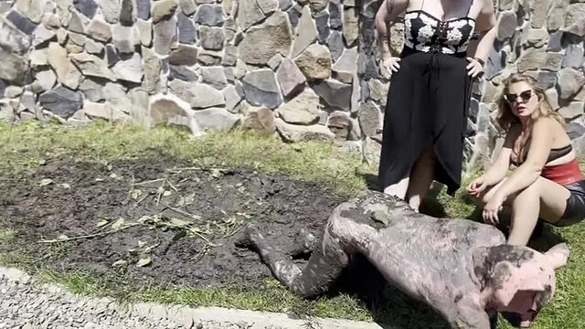 Slutty slave girl cleans her Mistress's dirty feet in mud