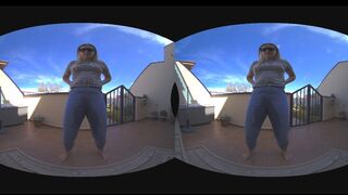 Wild chick pees outdoors, pants down, on pavement, in explicit VR scene.