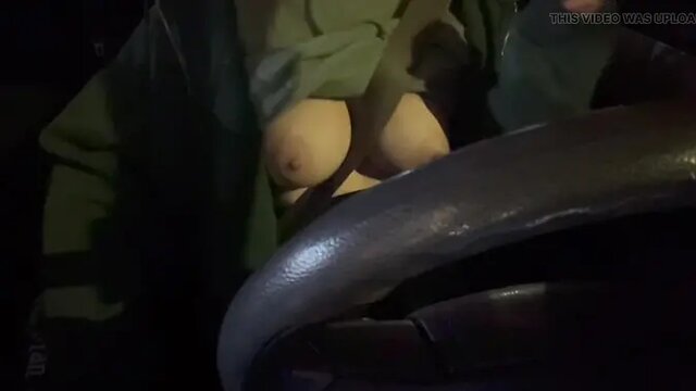 sexy MILF Artemisia Love shows off big juicy tits while driving