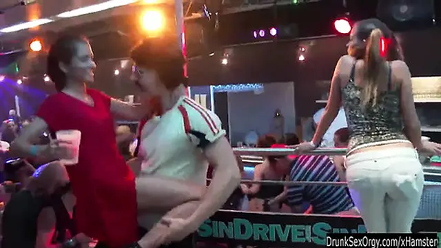 Bi girls engaging in wild public sex during a chaotic orgy