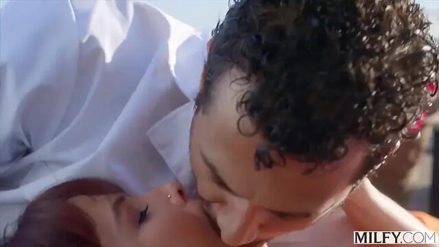 Experienced mature woman humps young man's cock poolside