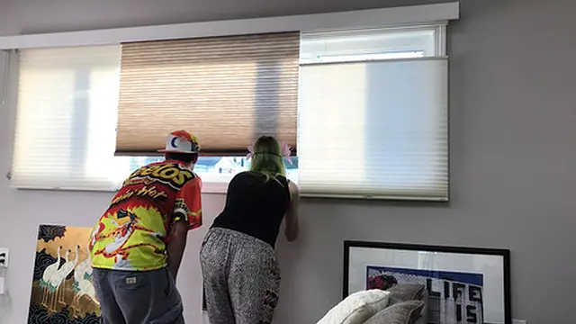 Couple Spying Through Neighbor′s Window