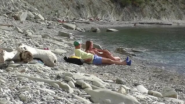 Naked Russian girl sucks blogger's big cock at nude beach