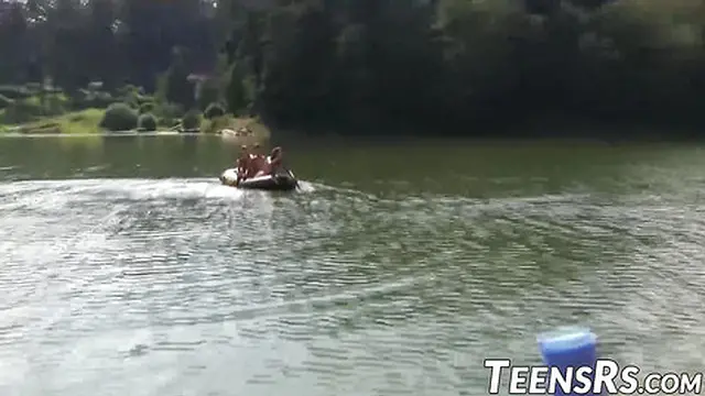 Teen girls play and laugh together in a sunny outdoor pool