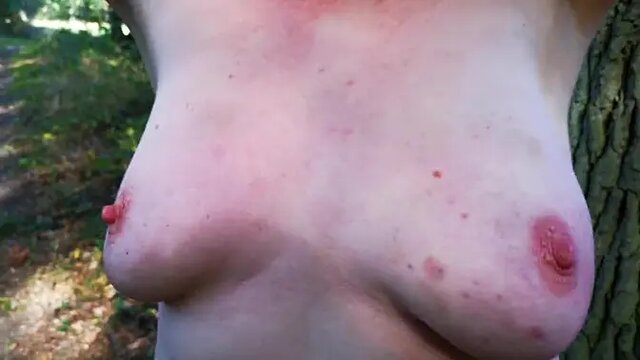 Naughty girls get their large tits slapped in public