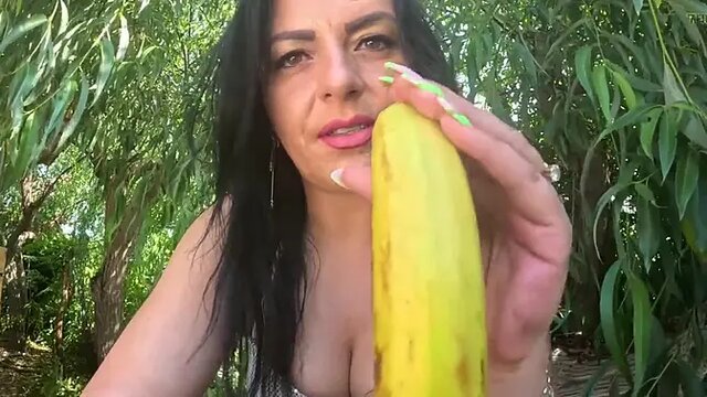 Big banana fills mouth as she gives sloppy blowjob