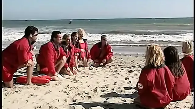 Busty brunette enjoys a passionate kiss as her friend pleases her from behind