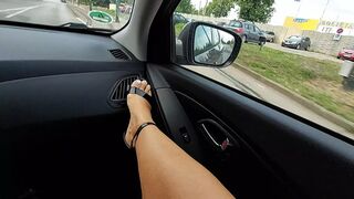 Stepmom in short skirt and heels with sexy legs rubs her pussy in the car in public and teases her stepson