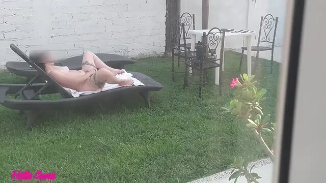 Secretly recorded girlfriend sunbathing and fingering her pussy