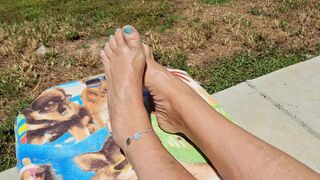 Relaxing in the sun showing off our oiled and pedicured feet
