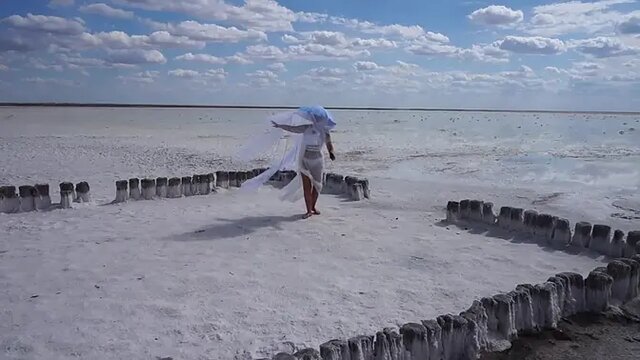 Sensual white wife dances seductively by the lake