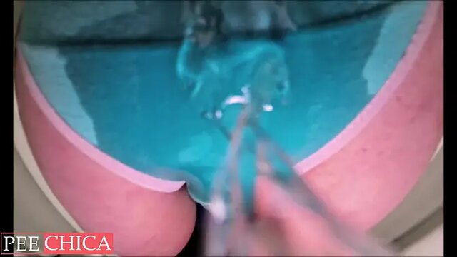 Amateur MILF pisses in public toilet and wets her panties