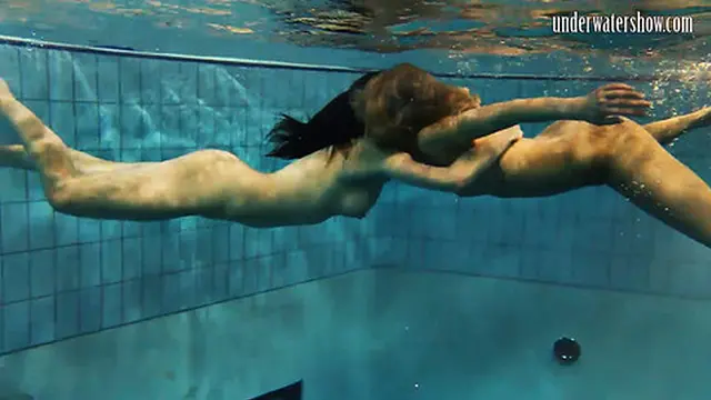 Beautiful teens explore sensual moments beneath the waves