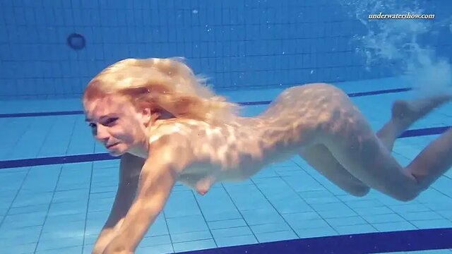 Underwater Russian slut shows off her tight 18 year old pussy in a swimsuit