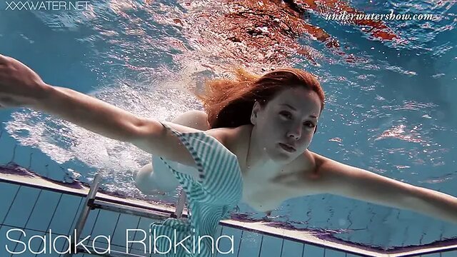Petite girl Salaka Ribkina shows off her tight little pussy underwater